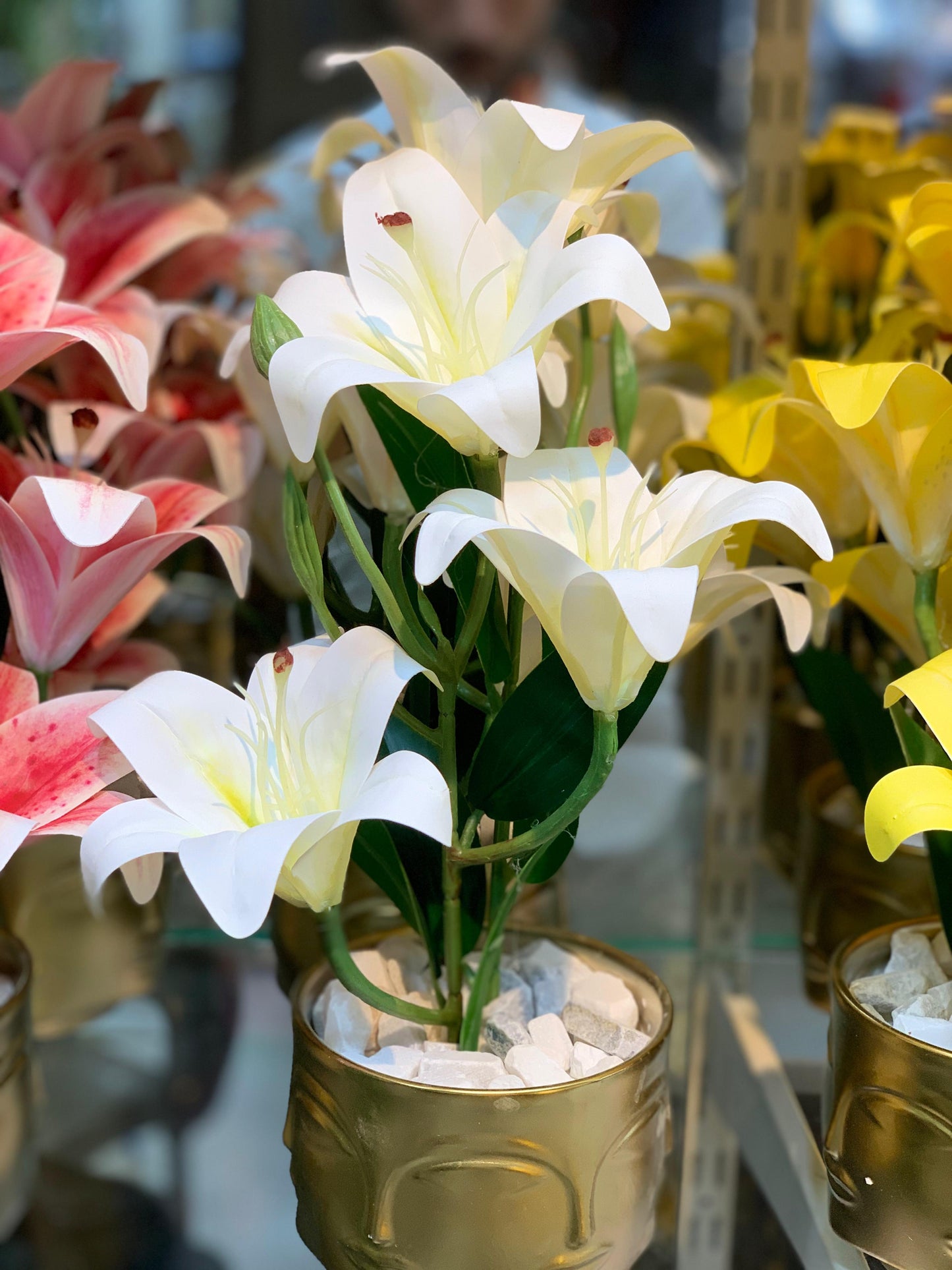 Buddha Face Planters with Artificial Lily Arrangements