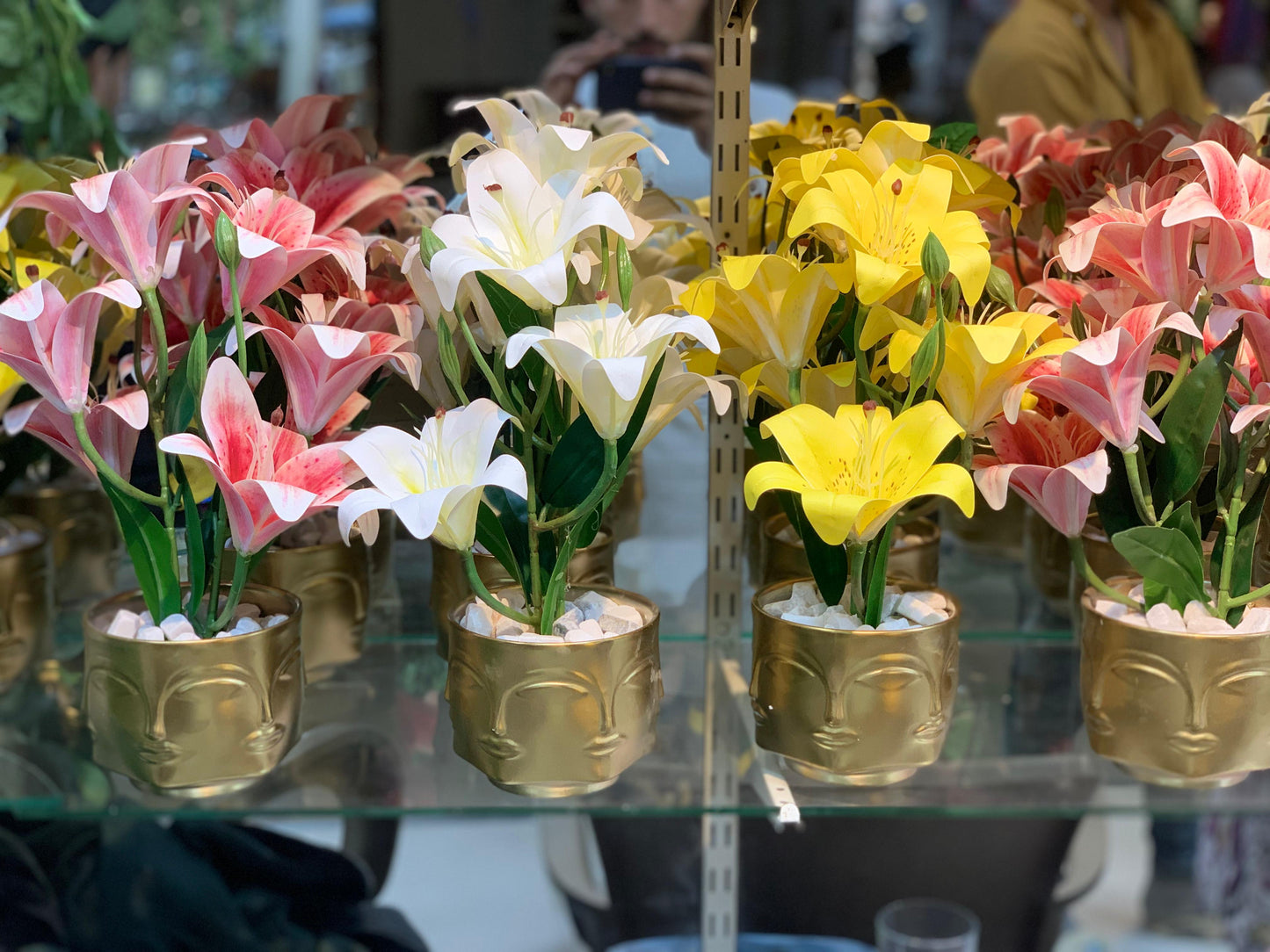 Buddha Face Planters with Artificial Lily Arrangements